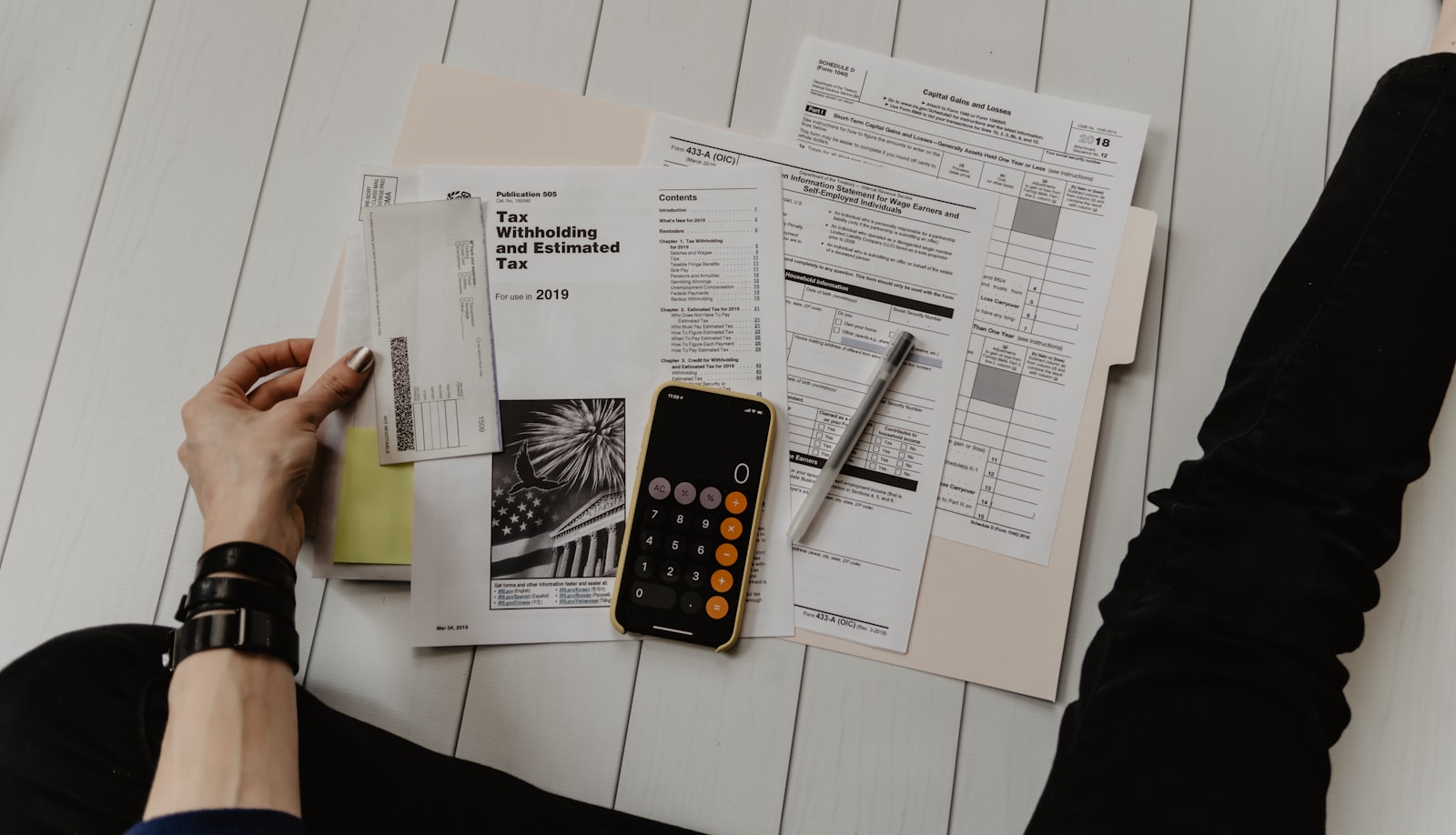 A printed valuation report and financial forecast laid out on a desk, used during a UK retirement exit planning meeting.